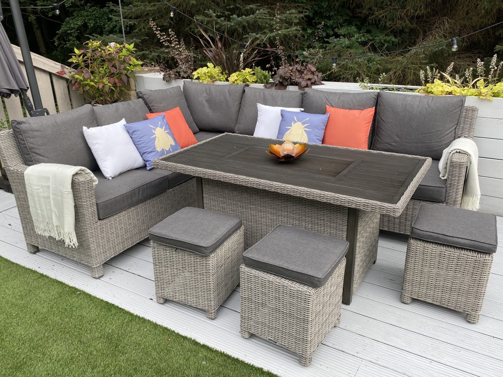 Modern outdoor corner sofa with cozy cushions and a spacious design.