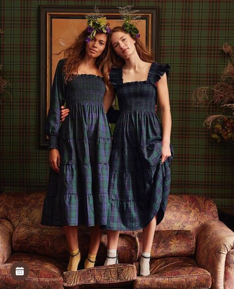 Two models in tartan dresses with floral headpieces in a traditional interior with tartan wallpaper. Styled by Angela Moffat, Stylist, Edinburgh, Scotland.